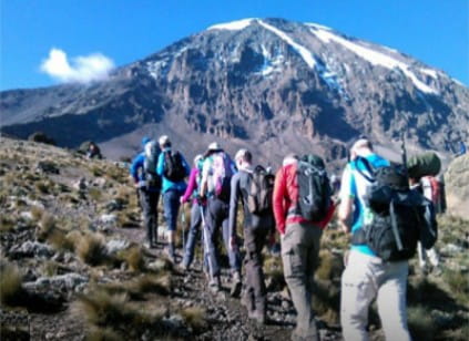 Hikers approaching Mount Kilimanjaro summit
